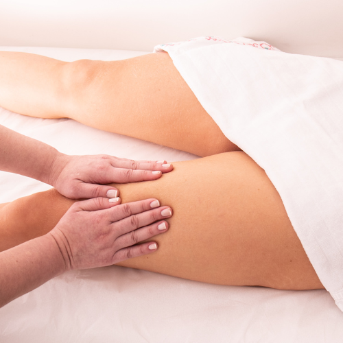 Lymphatic drainage massage technique being carried out on the leg of a patient