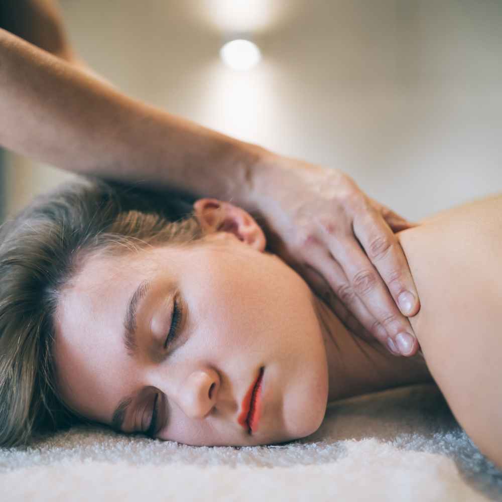 therapeutic massage on a woman laying down in chesterfield