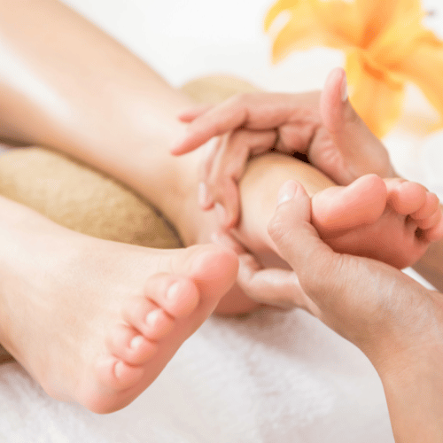 fertility reflexology being performed on a lady