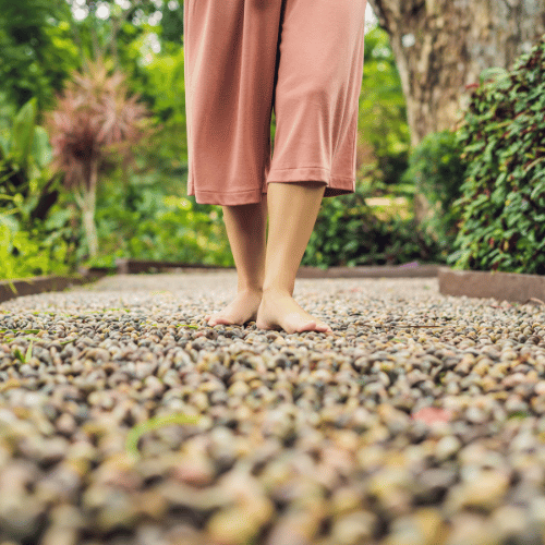 a woman over 50 walking, with only her feet in frame